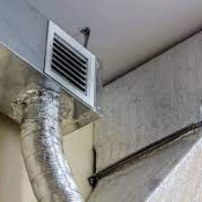 Air duct high on a wall