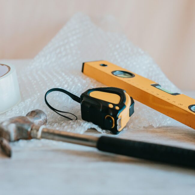 hammer, tape measure and spirit level