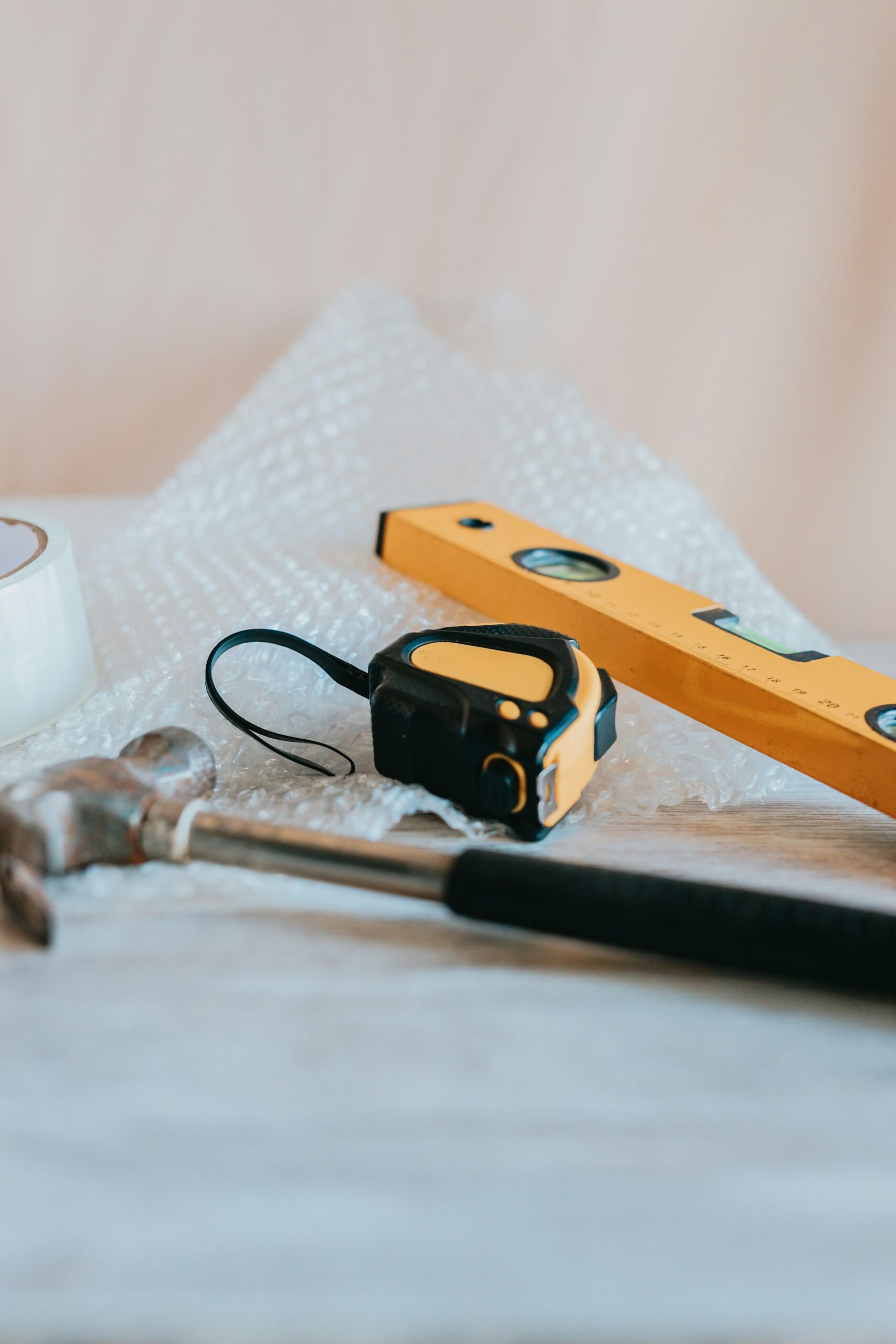 hammer, tape measure and spirit level