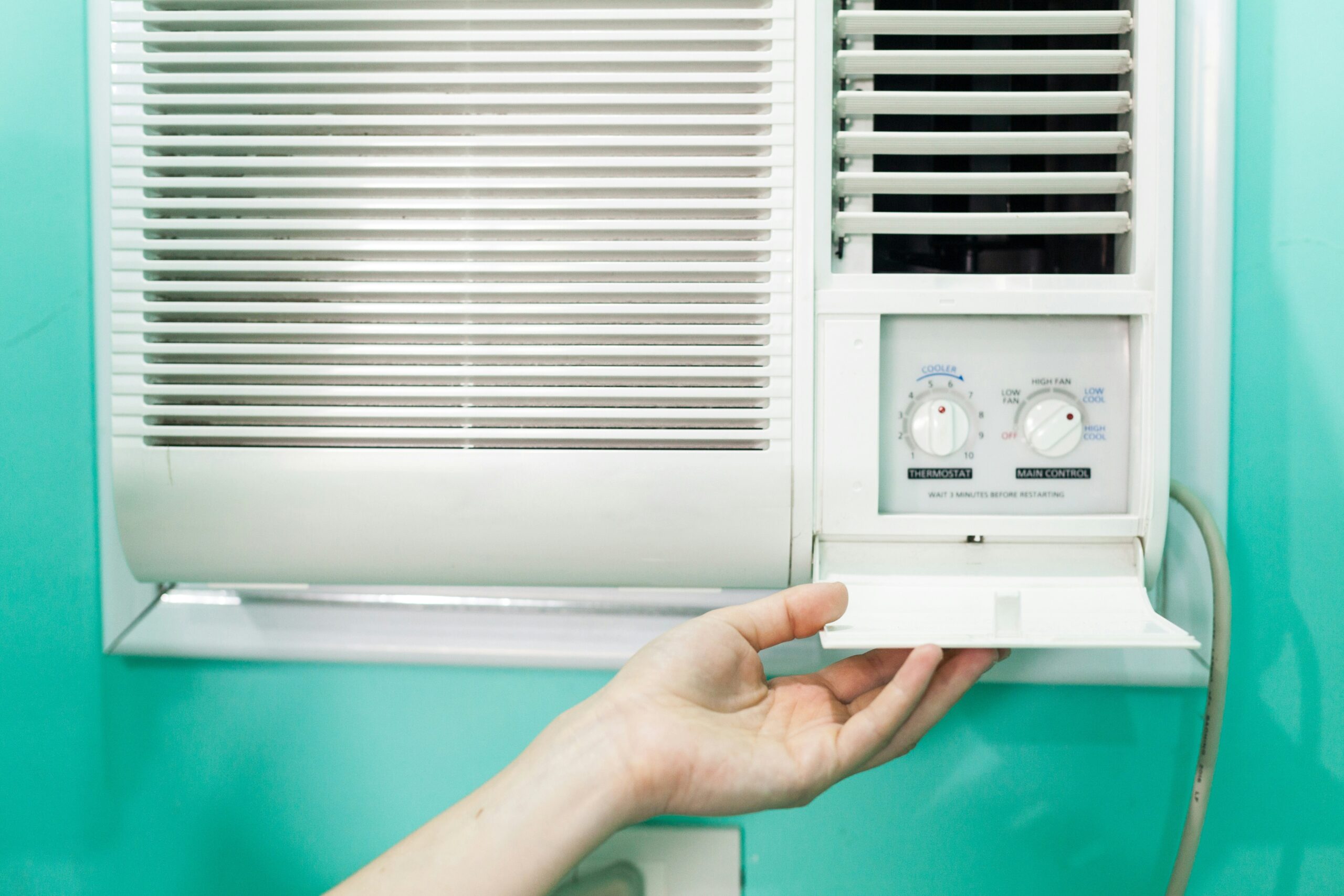 A technician in Mill Creek WA performing HVAC services by installing the system and ensuring its functioning properly.